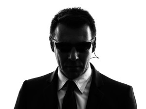 36946082 - one secret service security bodyguard agent man in silhouette on white background